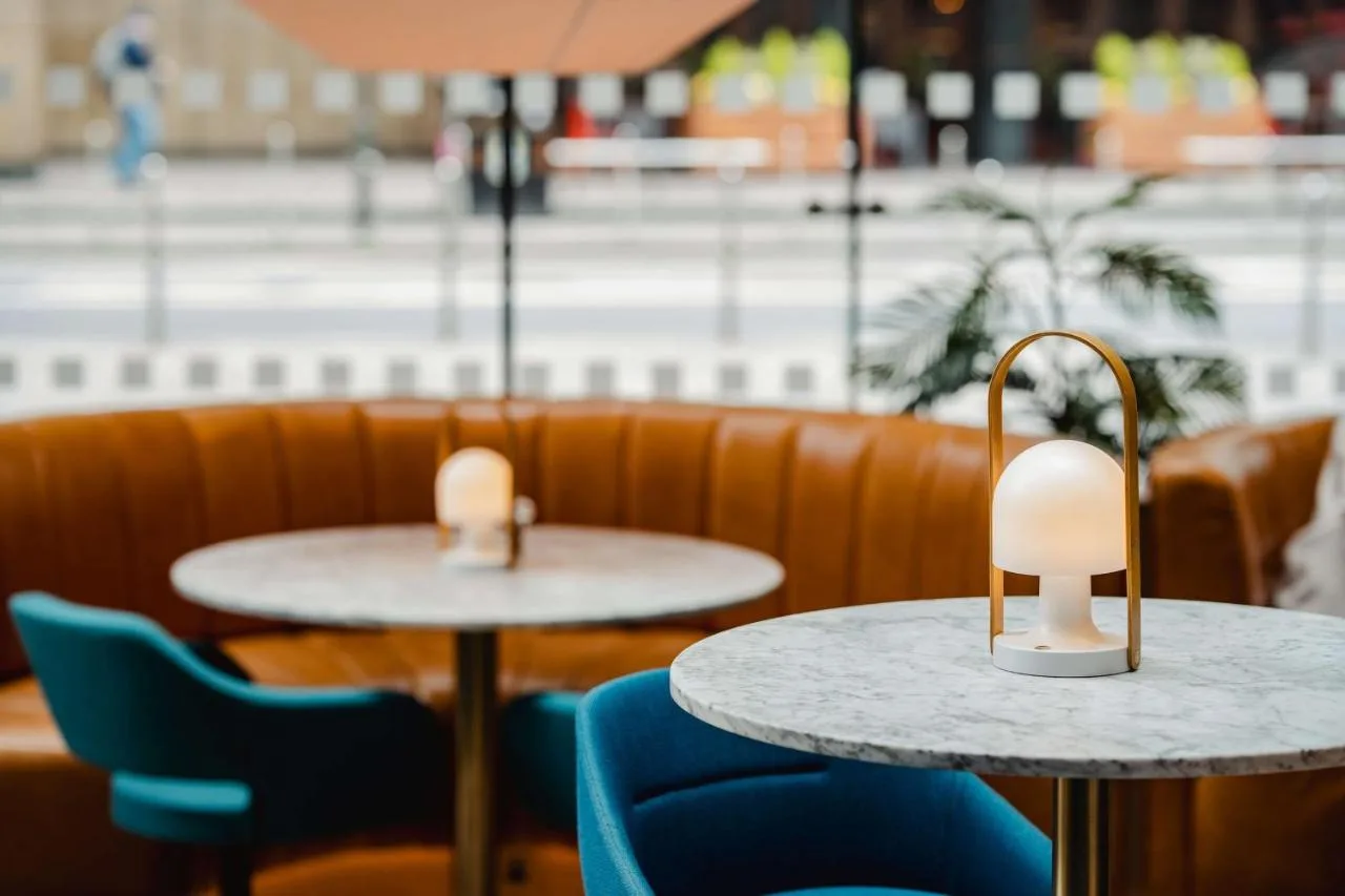 Lobby tables and blue chairs at Radisson Blu Hotel, Glasgow