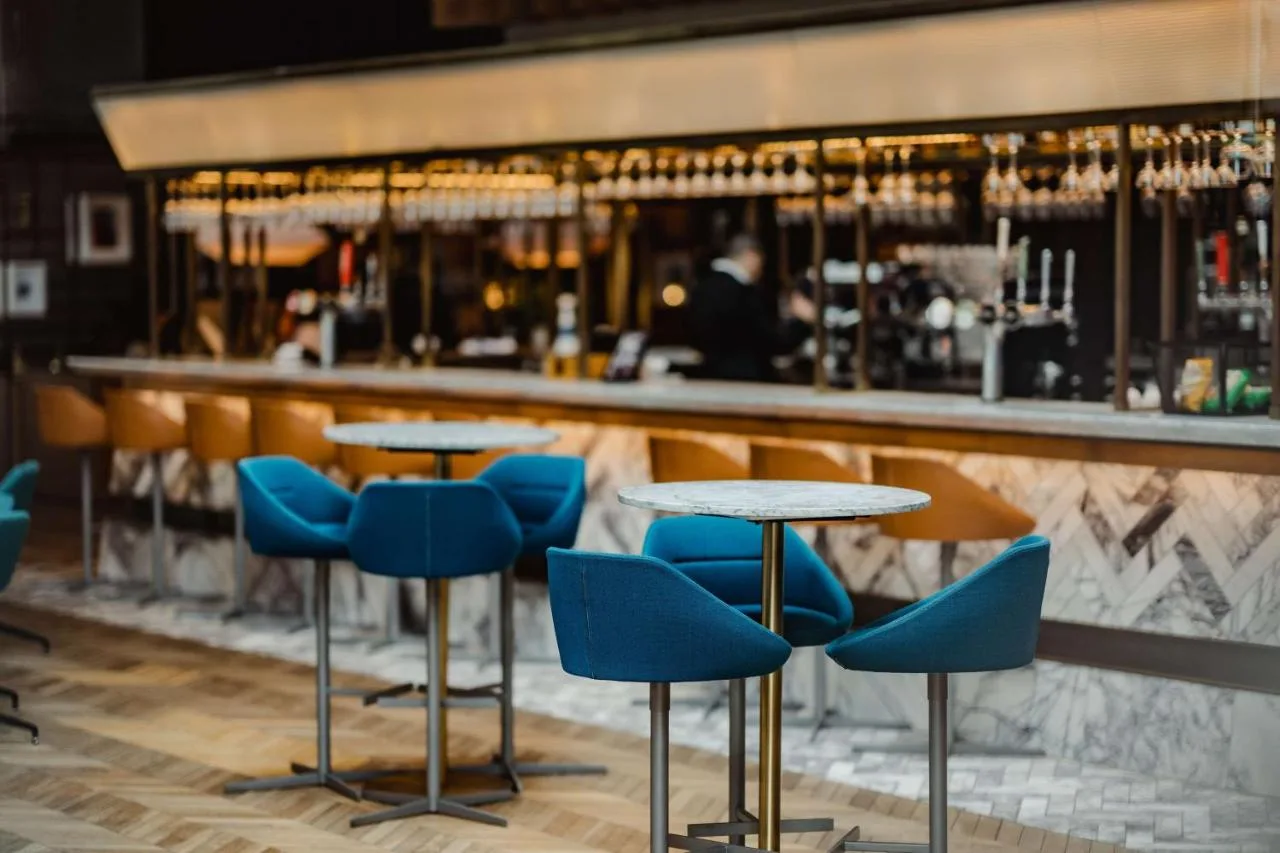 Bar area with blue chairs at Radisson Blu Hotel, Glasgow